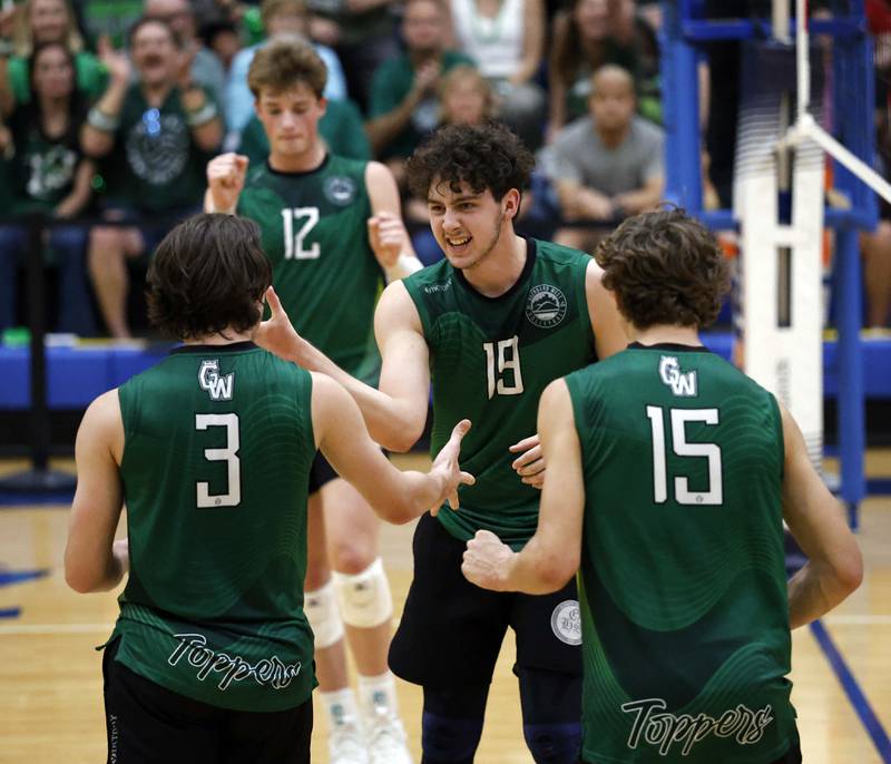 Glenbard West's Otis Yahn (19) reacts after a point with his teammates Andrew Fanella (3) Lukas Wallin (15) and Henry Truitt (12) during the championship match of the IHSA State Final Boys Volleyball Tournament Saturday, June 7, 2025 in Hoffman Estates.