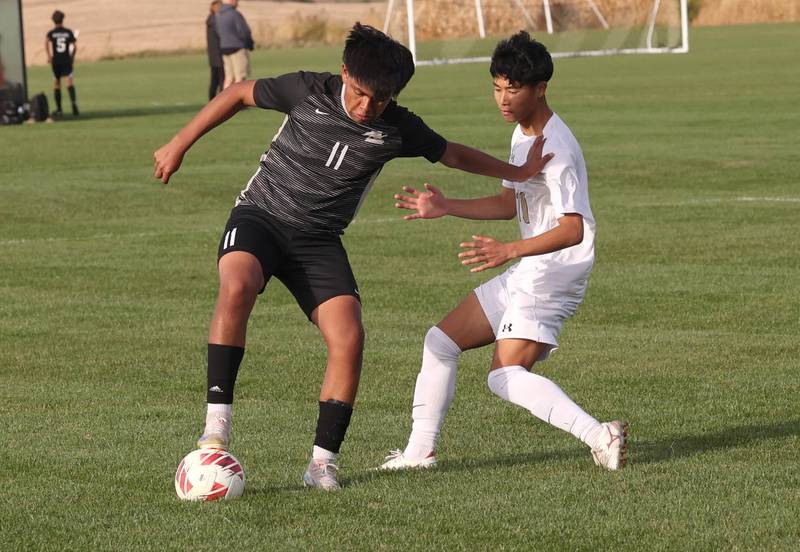 Kaneland's Abe Paulino (left) tries to hold off Sycamore's Chandler Gatbunton during their game Monday, Oct. 7, 2024, at Kaneland High School in Maple Park.