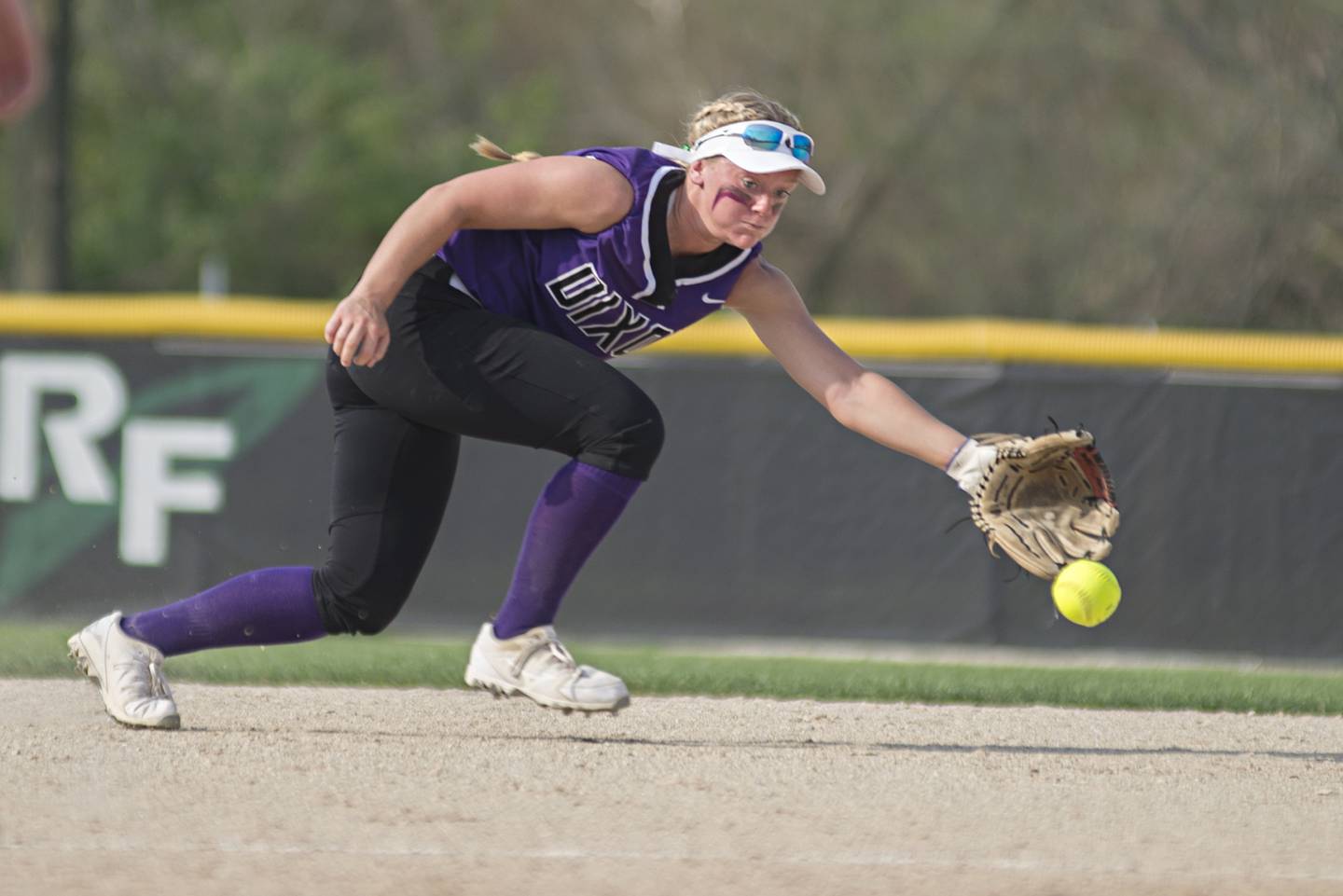 Dixon's Sam Tourtillott stretches but comes up short on a hot smash up the middle Tuesday, May 10, 2022 against Rock Falls.