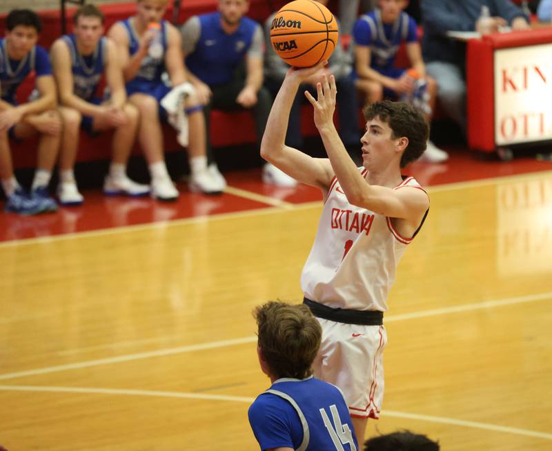 Ottawa's Colt Bryson lets go of a shot over Princeton's Jackson Mason during the Dean Riley Shootin' The Rock Thanksgiving Tournament on Monday Nov. 24, 2025 in Kingman Gymnasium at Ottawa High School.