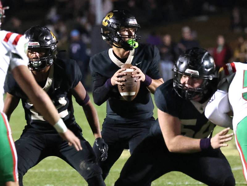 Sycamore's Griffin Larsen gets good pass protection from Dylan Curtis (left) and Clyde Nott during their game against La Salle-Peru Friday, Oct. 10, 2025, at Sycamore High School.