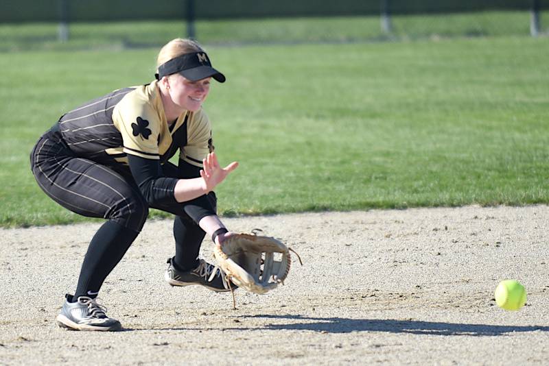 Bishop McNamara's Teagan McCue fields a grounder during a home game against Aurora Christian Tuesday, April 8, 2025.