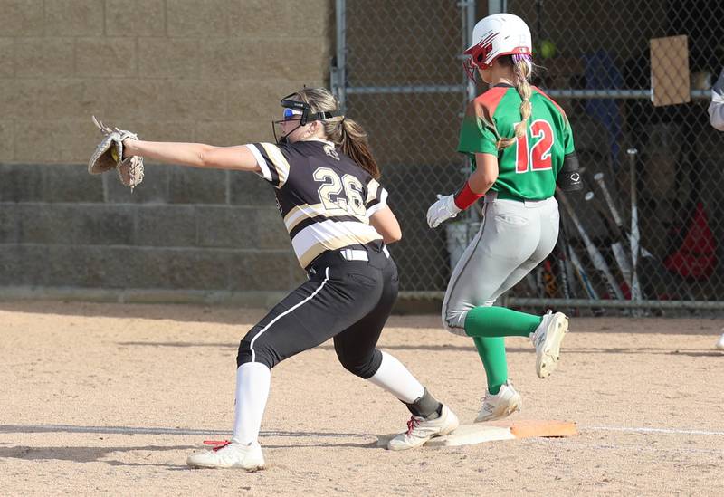 LaSalle-Peru's Taylor Martyn beats the throw to be safe at first as Sycamore's Kaitlyn Williams makes the catch during their game Tuesday, April 11, 2023, at Sycamore High School.