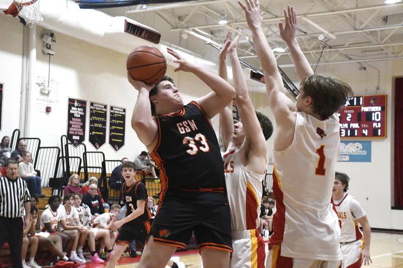Gardner-South Wilmington's Brock Enerson goes up for a shot while contested by St. Anne's Raleigh Hays and Jackson Hawkins during St. Anne's 52-45 victory over Gardner-South Wilmington on Tuesday, January 13, 2026.