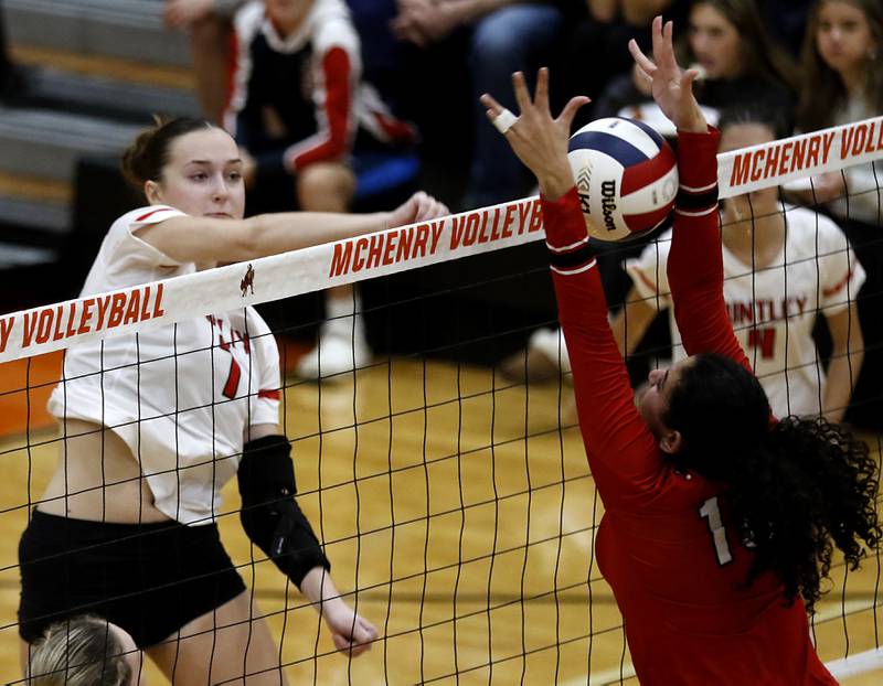 Huntley's Jocelyn Erling spikes the ball against Mundelein's Sophia Mitry during an IHSA Class 4A McHenry Sectional volleyball match on Tuesday, Nov. 5, 2024, at McHenry High School Freshman Campus.