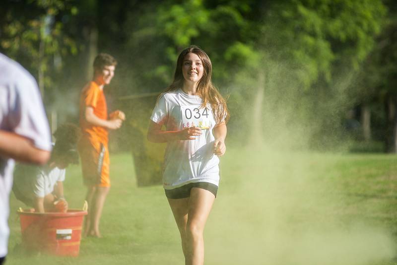 Bella Henson of Prophetstown hits the yellow color station during her run Saturday, August 6, 2022.
