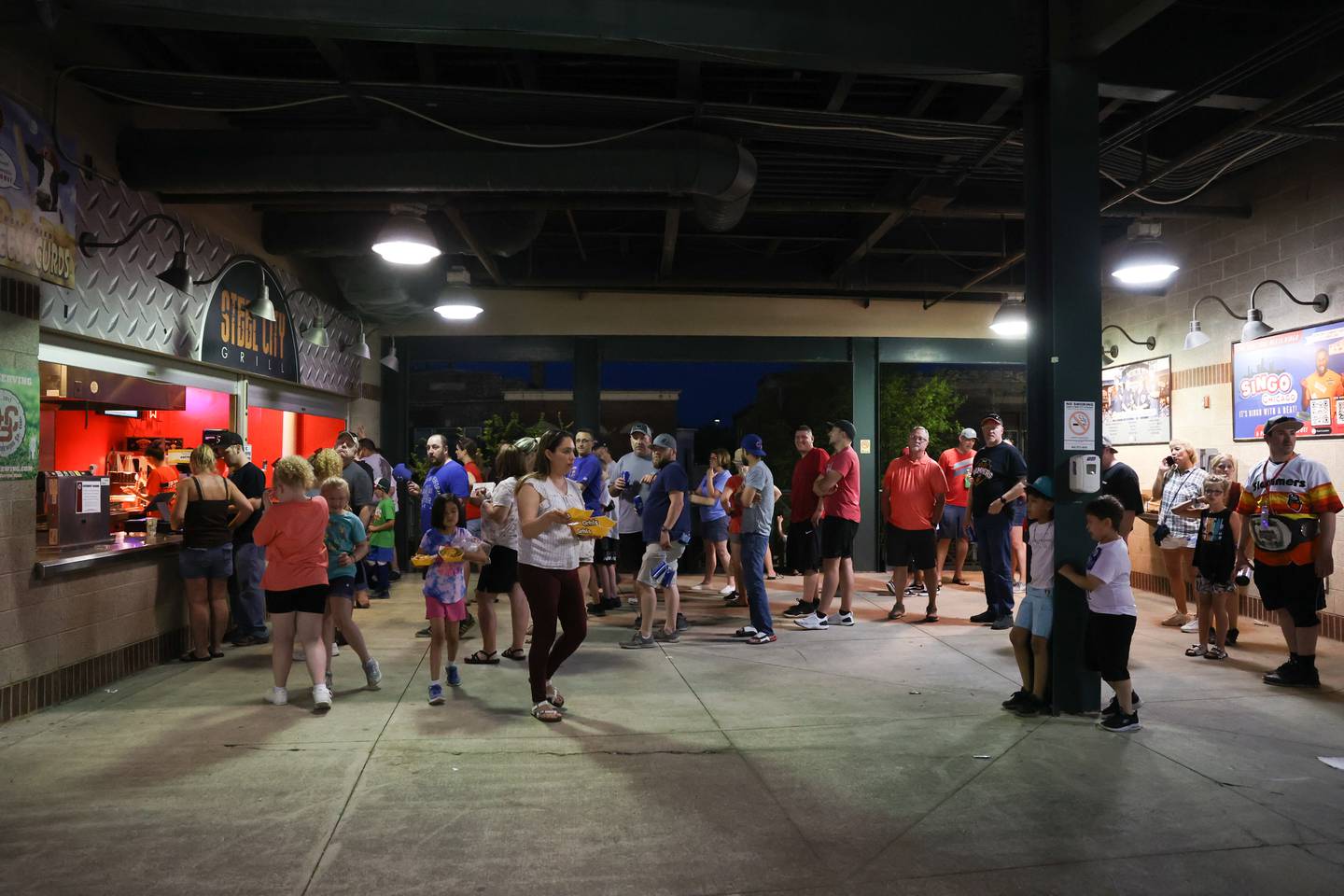 Fans wait in line for the Steel Grill at the Joliet Slammers home opener against the Ottawa Titans. Friday, May 13, 2022, in Joliet.