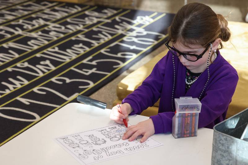 Shabbona Elementary School kindergartener Sawyer Arlis works on a coloring sheet while dressed up for the 100th day of school on Monday, Feb. 9, 2026.