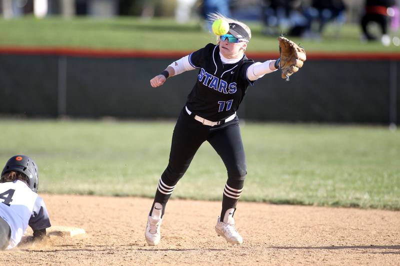 St. Charles North’s Auburn Roberson reaches for the ball during a game at Wheaton Warrenville South on Thursday, April 14, 2022.