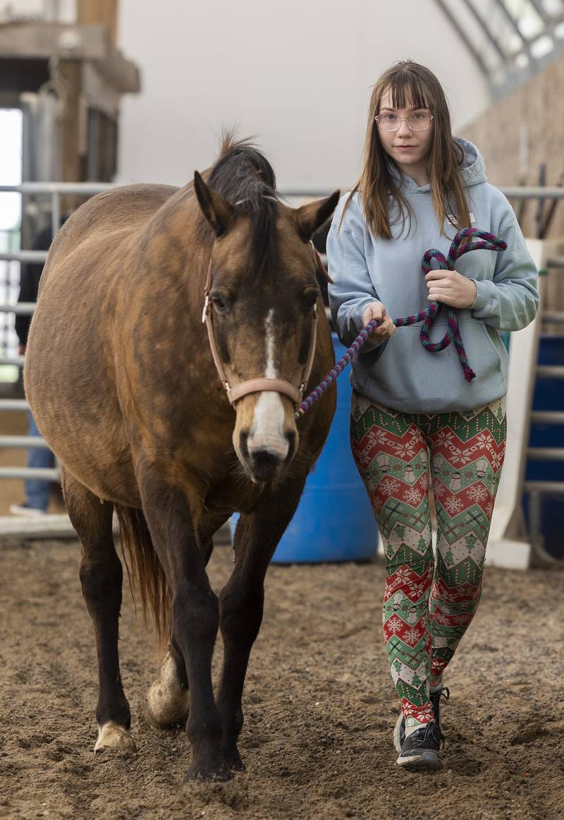 Student Jessica keeps in step with a horse Tuesday, May 6, 2025, at Pegasus Special Riders.