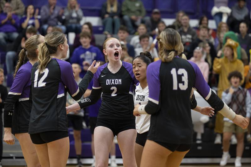 The Dixon Duchesses celebrate their first set win over Morris Thursday, Oct. 31, 2024 in the class 3A regional championship at Dixon High School.
