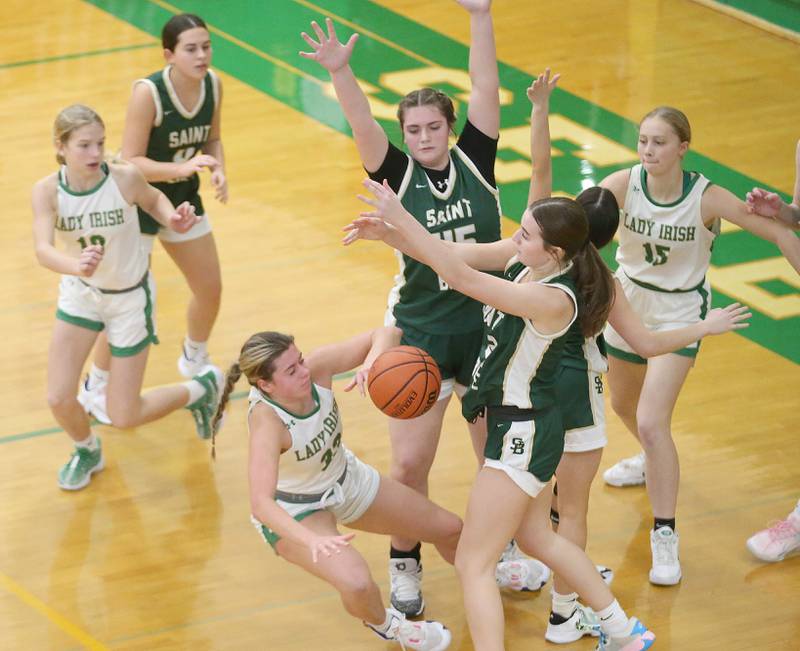Seneca's Audry Mcnabb slips in the lane as St. Bede's Savannah Bray and Quinn McClain on Monday, Jan. 29, 2024 at Seneca High School.