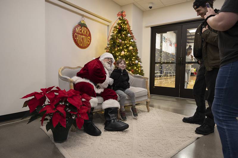 Liam Oldenburg, 4, of Dixon has a picture taken with Santa Monday, Dec. 16, 2024, at The Facility in Dixon.