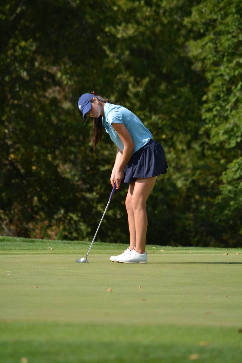 Oswego Co-Op sophomore Alli Wiertel lines up a putt during the Class 2A state golf tournament at Hickory Point Golf Course in Forsyth.