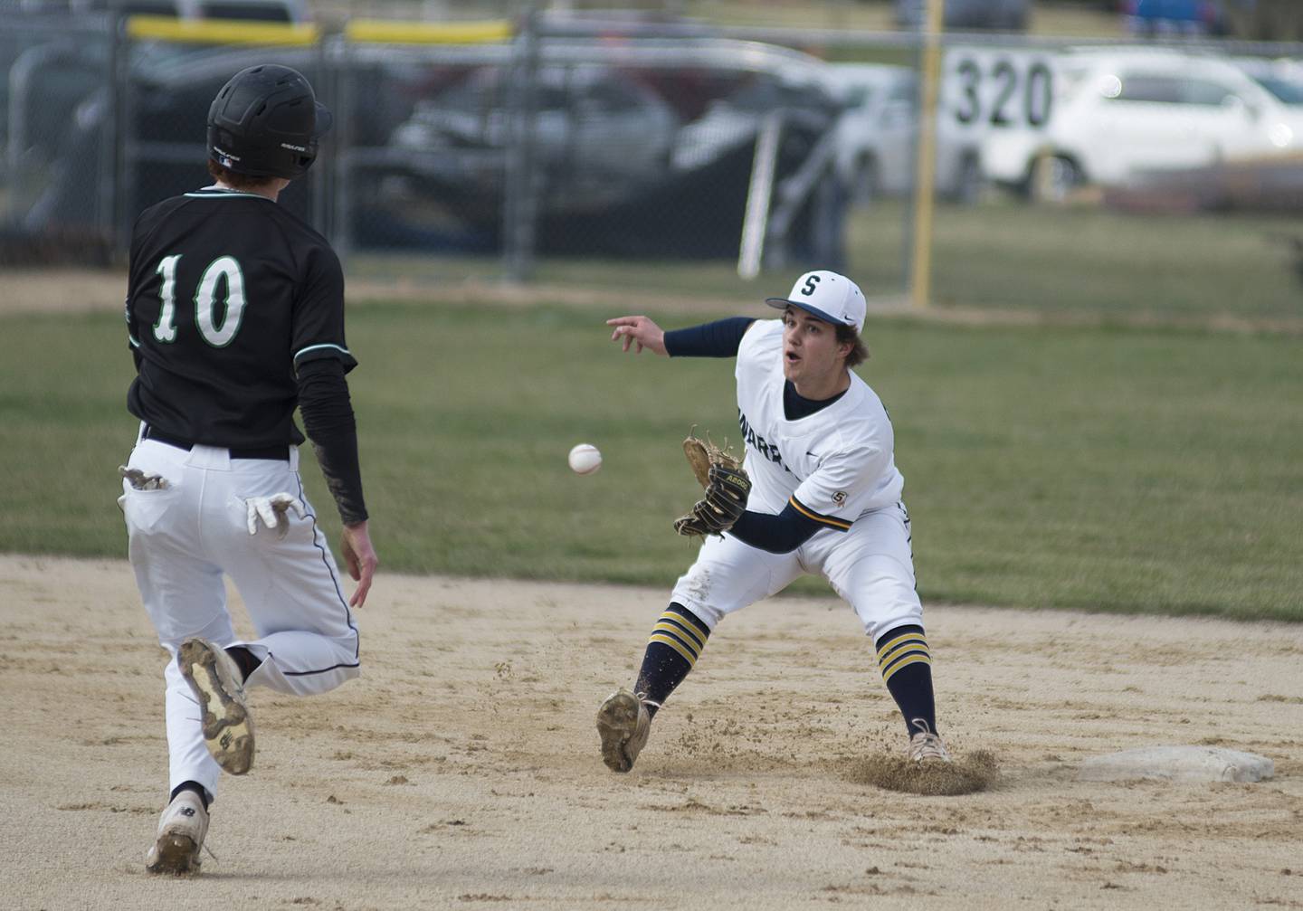 Sterling's Colt Adams waits for the throw before tagging out Alleman’s Chance Carruthers trying to steal second Tuesday, April 5, 2022.