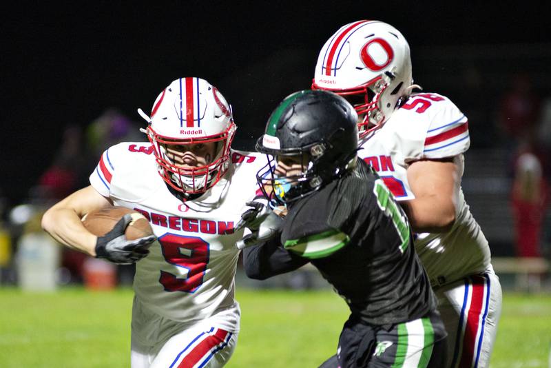 Oregon’s Noah Reber picks up yards against Rock Falls Friday, Oct. 14, 2022.