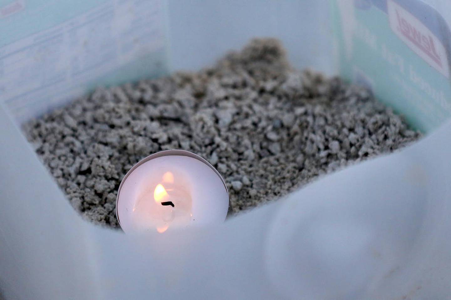 A candle is lit inside a milk jug at the start of the Holiday Night Hike at Veteran Acres Park on Friday, Dec. 4, 2020 in Crystal Lake.  The event was rebranded from a one-night "Luminaria Walk" event to a 6-night "Holiday Night Hike" to allow for better social distancing to avoid a crowded one-night event.