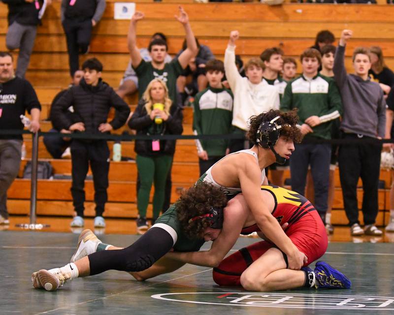 Batavia's wrestler Jack Duraski, right,  keeps a hold of Glenbard West's wrestler Ulises Rosas in the 132 weight class where Jack took the win during the regional title match held on Saturday Feb 3, 2024, held at Glenbard West High School.