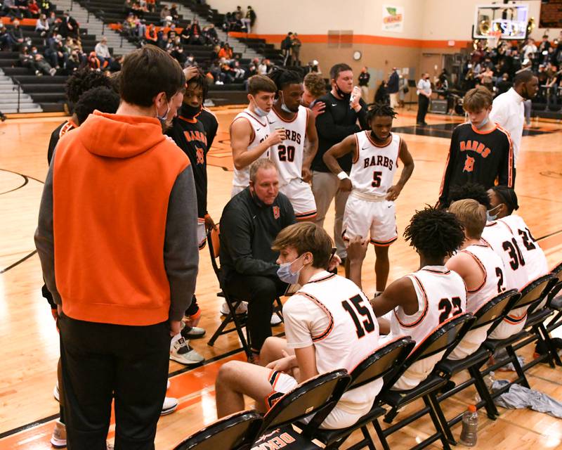 DeKalb head coach Mike Reynolds talks to the team during a break in the action during the first quarter Friday Jan. 21st while taking on Metea Valley in DeKalb.