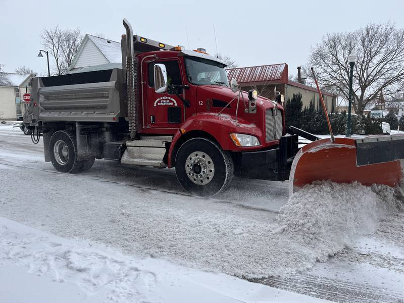 A snow plow works to clear South Peoria Avenue in Dixon as a winter storm hit the area Wednesday, Feb. 12, 2025.