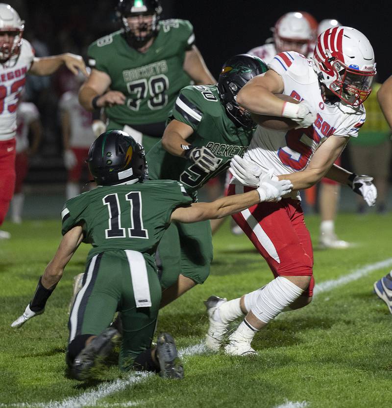 Oregon’s Hunter Bartel looks for yards against Rock Falls Friday, October 11, 2024, in Rock Falls.