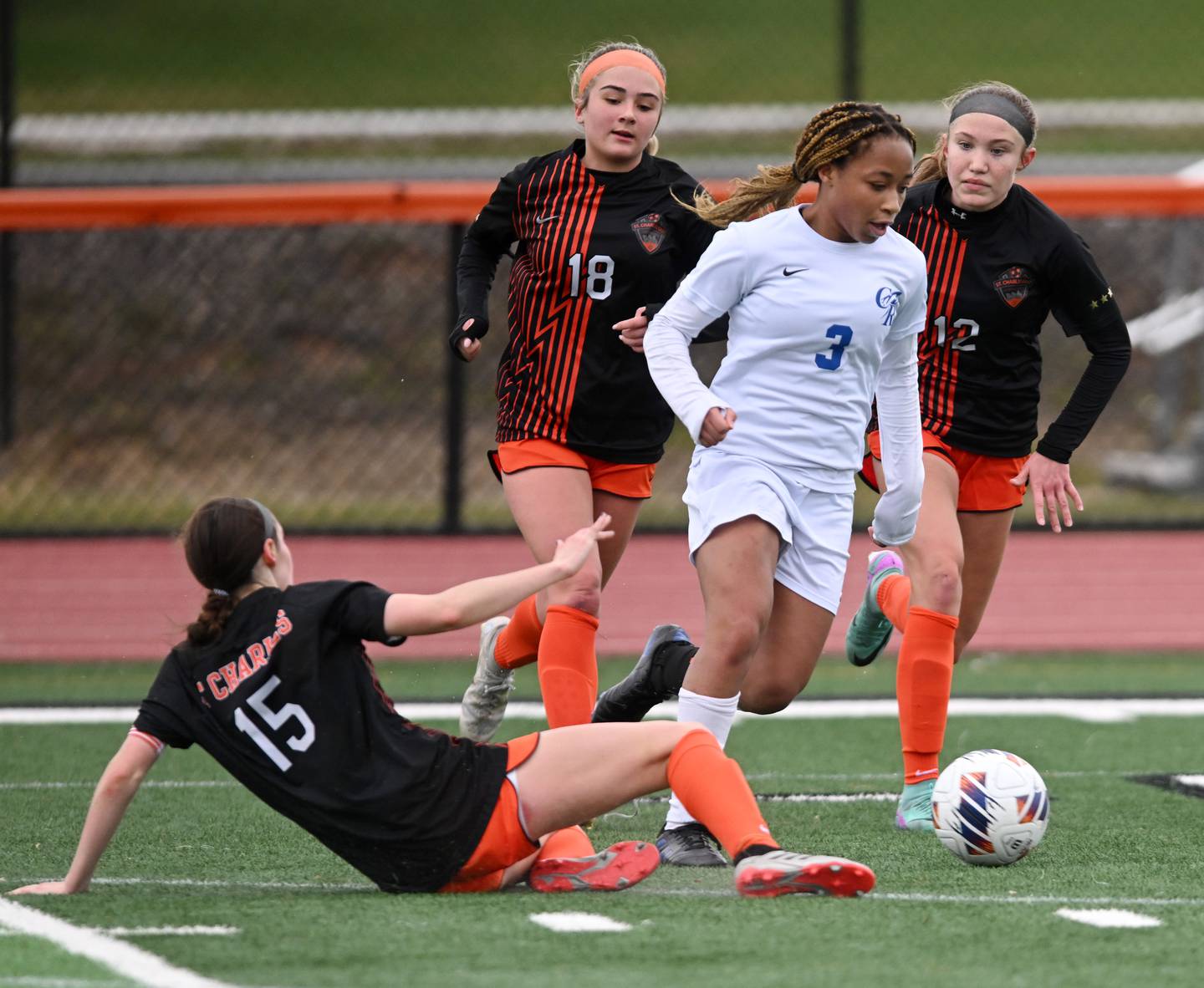 Burlington Central’s Mekenzie Rogers, middle, eludes St. Charles East players including, from left, Alli Saviano, Payton Rivard and Sophia Wollenberg during a girls soccer match played on  Tuesday, March 26, 2024 in St. Charles.