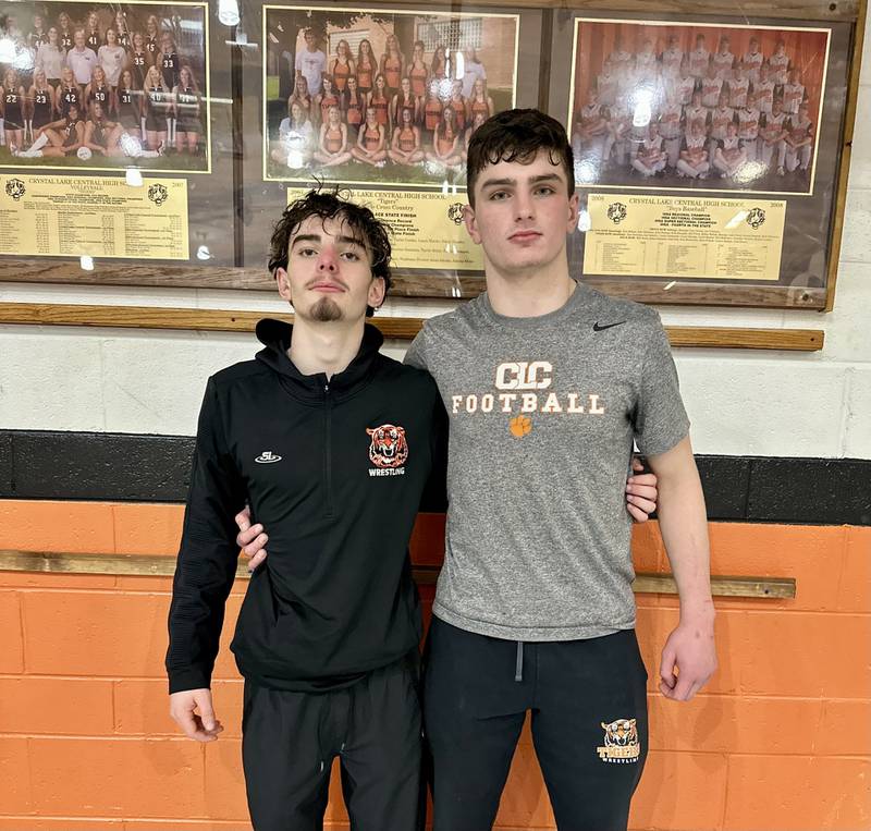 Crystal Lake Central's Jackson Marlett and Nick Zuehlke (left to right) were two of the 10 Tigers to earn victories during Friday's dual against Cary-Grove.