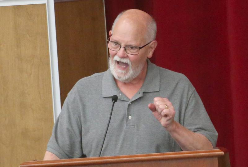 Tom Walsh speaks to the Illinois Health Facilities and Services Review Board during a public hearing regarding OSF St. Elizabeth Hospital's plans to reduce services on Tuesday, June 10, at Central Intermediate School in Ottawa.
