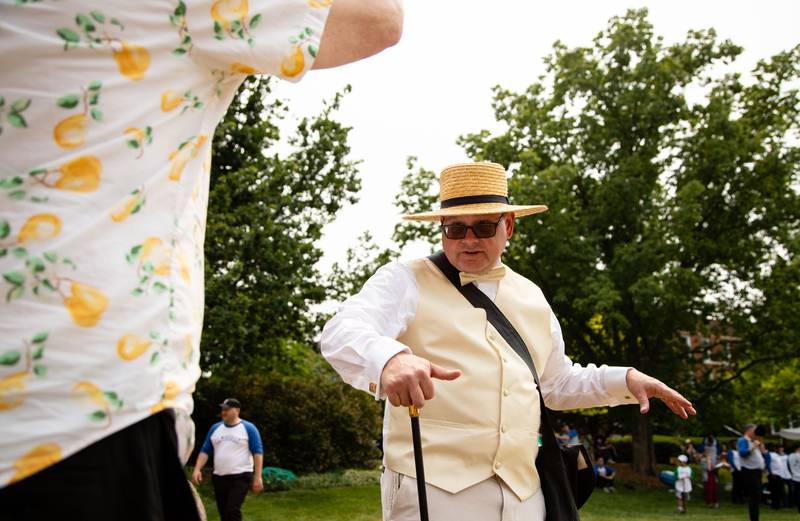 Barrister (umpire) Dave Oberg talks to a fan between innings of the Elmhurst Heritage Foundation's Vintage Baseball Game at Elmhurst University Mall on Sunday, June 4, 2023.