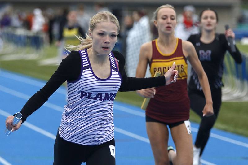 Plano’s Corrine Kostelaz closes the finish line to win the 4x100 meter relay during the Kishwaukee River Conference Girls Track and Field Meet on Tuesday, May 5, 2025, at Woodstock High School.
