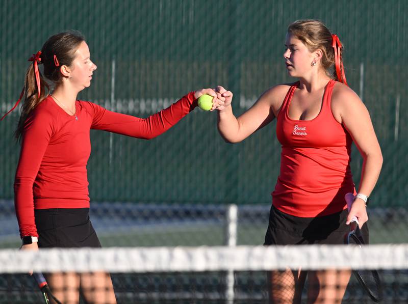 Benet Academy’s Katie Jendra, left, and Natalie Grover celebrate a point during the Class 1A doubles third-place match of the girls state tennis tournament at Hersey High School on Saturday, Oct. 26, 2024 in Arlington Heights.