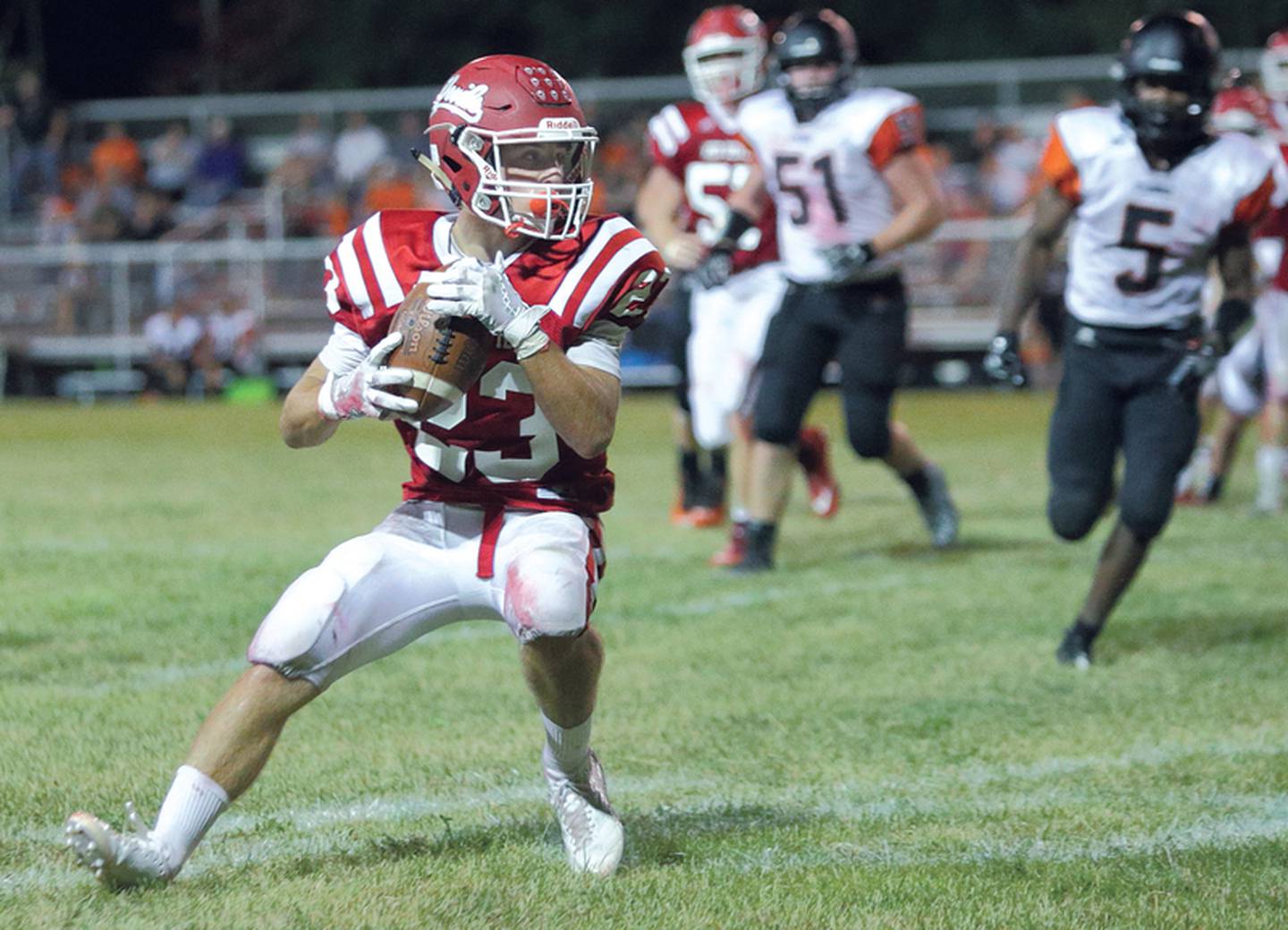 Hall junior James Mautino looks for running room after hauling in a pass.