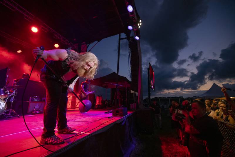 Blacktop Mojo vocalist Matt James bows to the crowd after the first song of their set at Streatorfest on August 1, 2024.
