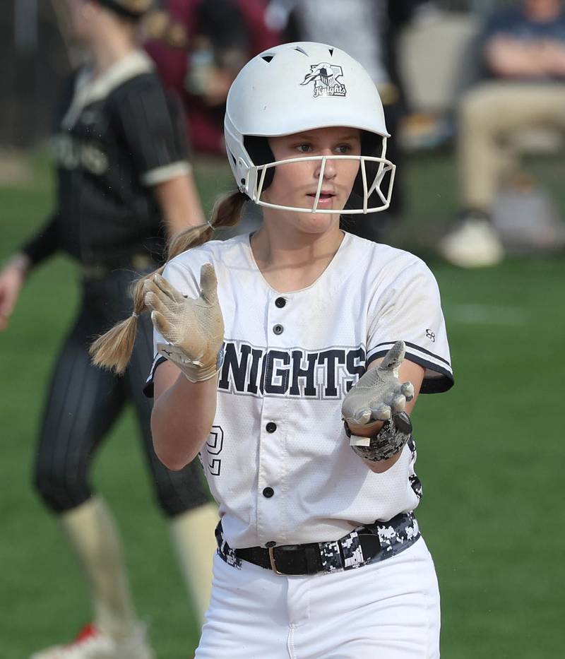 Kaneland's Ellie Peck claps after hitting a double Tuesday, April 22, 2025, during their game at Sycamore High School.