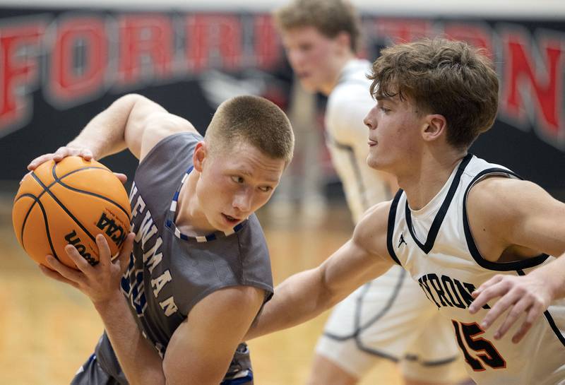 Newman’s George Jungerman works against Byron’s Ben Hively Friday, Dec. 19, 2025, in the Forreston Holiday Tournament title game.