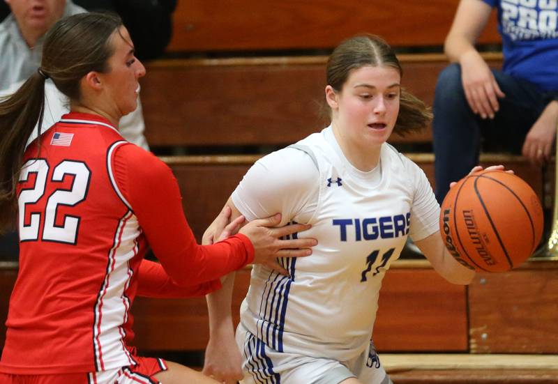 Princeton's Makayla Hecht dribbles around Hall's Kennedy Wozniak during the Princeton Holiday Girls Basketball Tournament on Friday, Nov. 23, 2024 at Princeton High School.