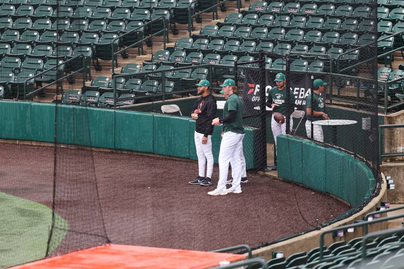 Players check the field as practice was delayed due to the rain at Duly Health and Care Field as the team prepares for the Joliet Slammers’ opening day on Friday.