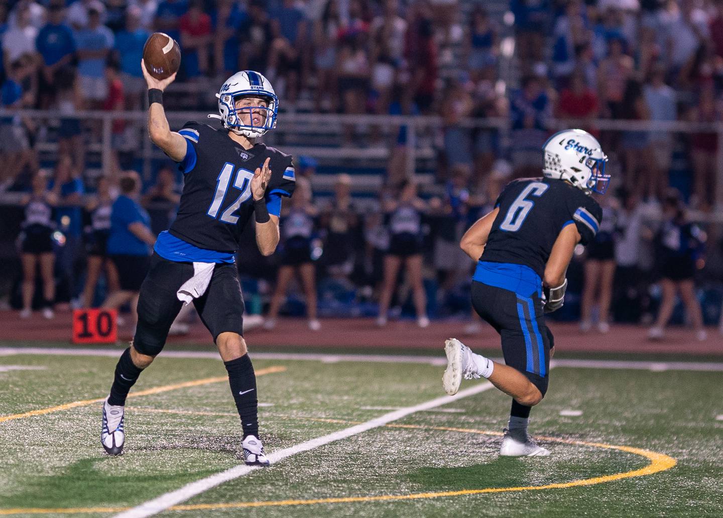 St. Charles North's Will Vaske (12) throws a pass against Lake Zurich during a football game at St. Charles North High School on Friday, Sep 2, 2022.