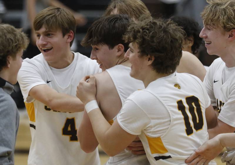 Jacobs' Nolan Roper, (left to right) Mark Takasaki and Ben Jirak celebrate defeating McHenry in a Fox Valley Conference boys basketball game on Wednesday, Nov. 29, 2023, at Jacobs High School in Algonquin.