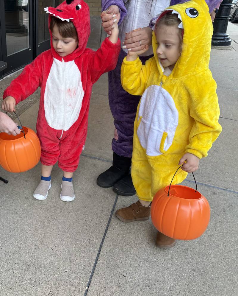 Luca McHenry, 3,  and Sofia McHenry, 2, of Geneva trick or treat during Halloween on the Square in Woodstock Oct. 31, 2025.