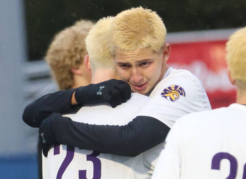 Mendota's Johan Cortez hugs teammate Alex Beetz during the Class 1A State title game on Saturday, Nov. 8, 2025 at Hoffman Estates High School.