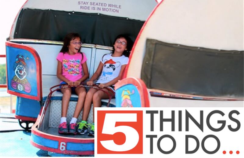 Scout Richmond (left), 11, of Lakemoor, and her sister, Sydney, 7, ride the Tilt-A-Whirl while attending Lakemoor Fest in Morrison Park in 2020.