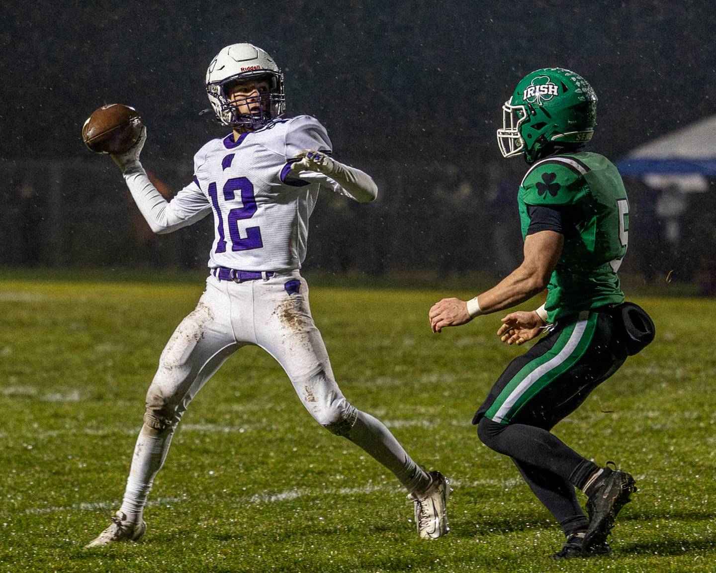 Fynn Brant (12) of Wilmington looks down field for receiver on Saturday, November 8, 2025 at Seneca High School in Seneca.
