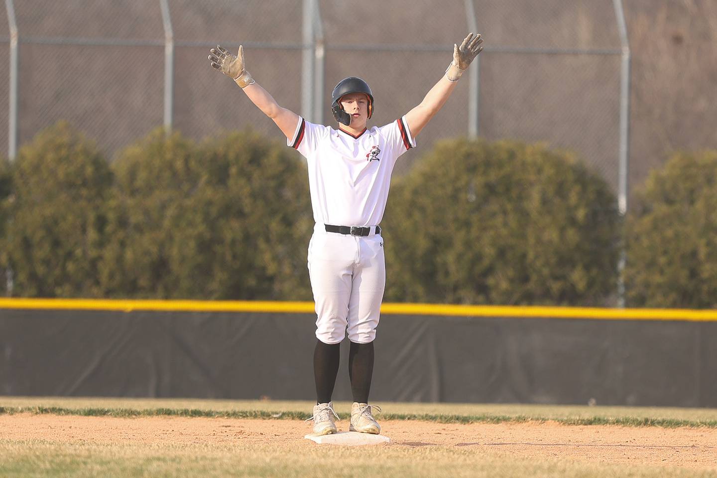Lincoln-Way Central’s Austin Welsh celebrates at second after driving in two runs against Joliet Catholic on Wednesday, March 25, 2026 in New Lenox.