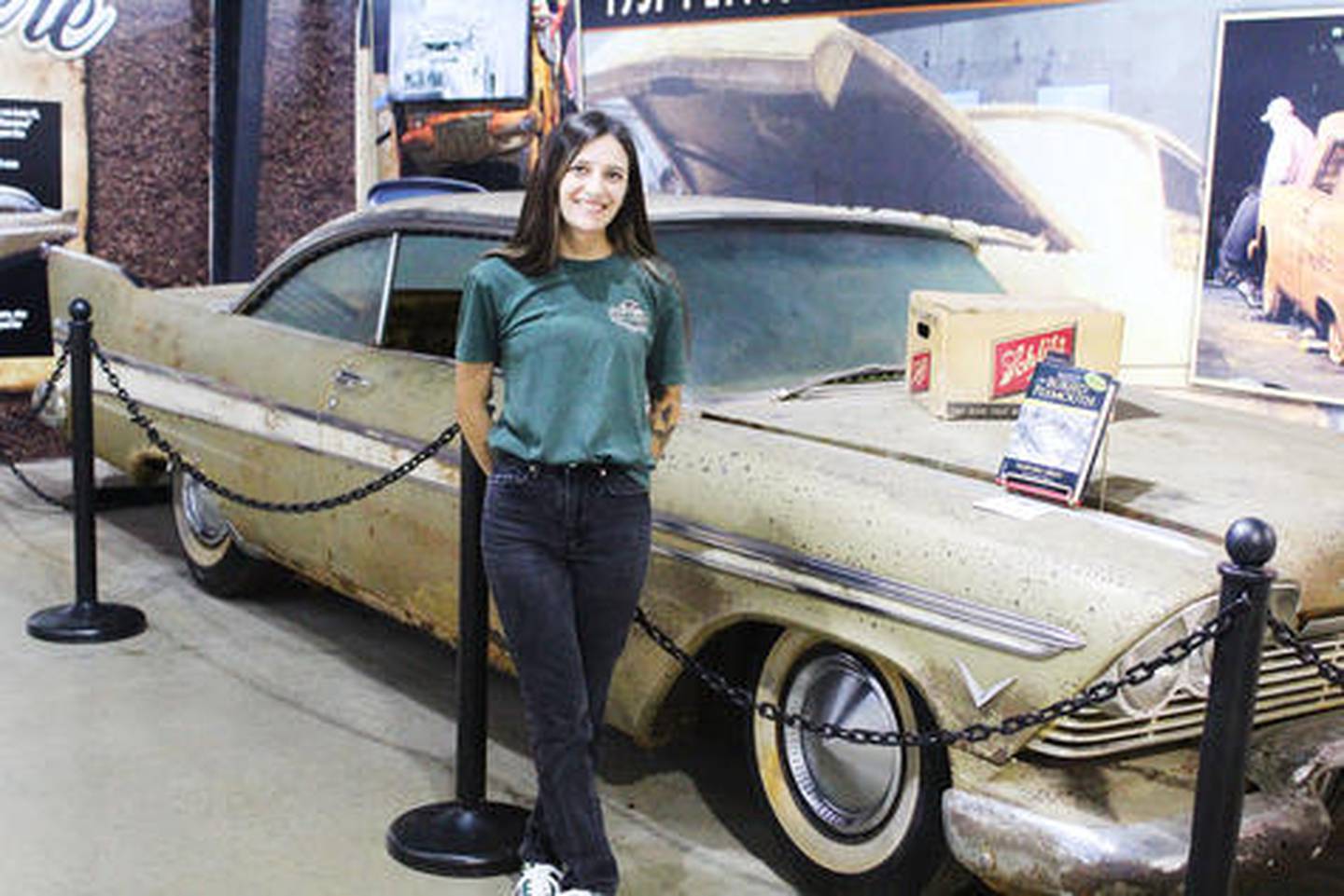 Alex Merry, museum director at Historic Auto Attractions in Roscoe, poses with a 1957 Plymouth Belvedere with an interesting story to tell: It was buried along with gasoline and a case of Schlitz beer for 50 years in a time capsule that was damaged before its unearthing in 2007.