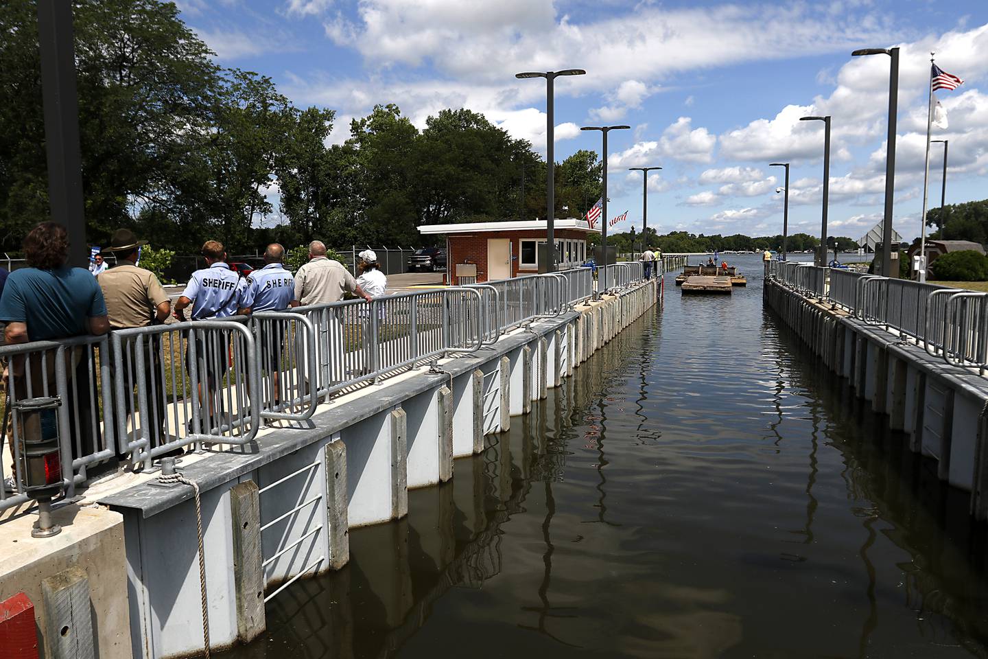 A large barge enters the locks during a completion celebration of the $22 million improvement project of the Stratton Lock and Dam, 2910 State Park Road, in McHenry, on Wednesday, July 13, 2022. The dam, that is operated by Illinois Department of Natural Resources’s Office of Water Resources, to help ensure safe and efficient recreational boating on the Fox River Chain of Lakes. Close to 20,000 watercraft pass through the lock during the boating season.