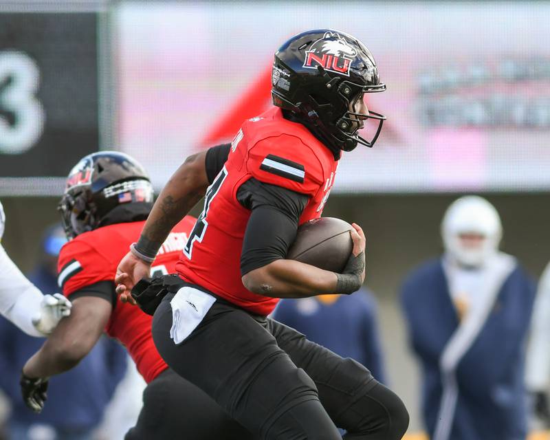 Northern Illinois University's quarterback Jalen Macon (14) runs the ball during the game against Kent State on Friday Nov. 28, 2025, held at Huskie Stadium in DeKalb.