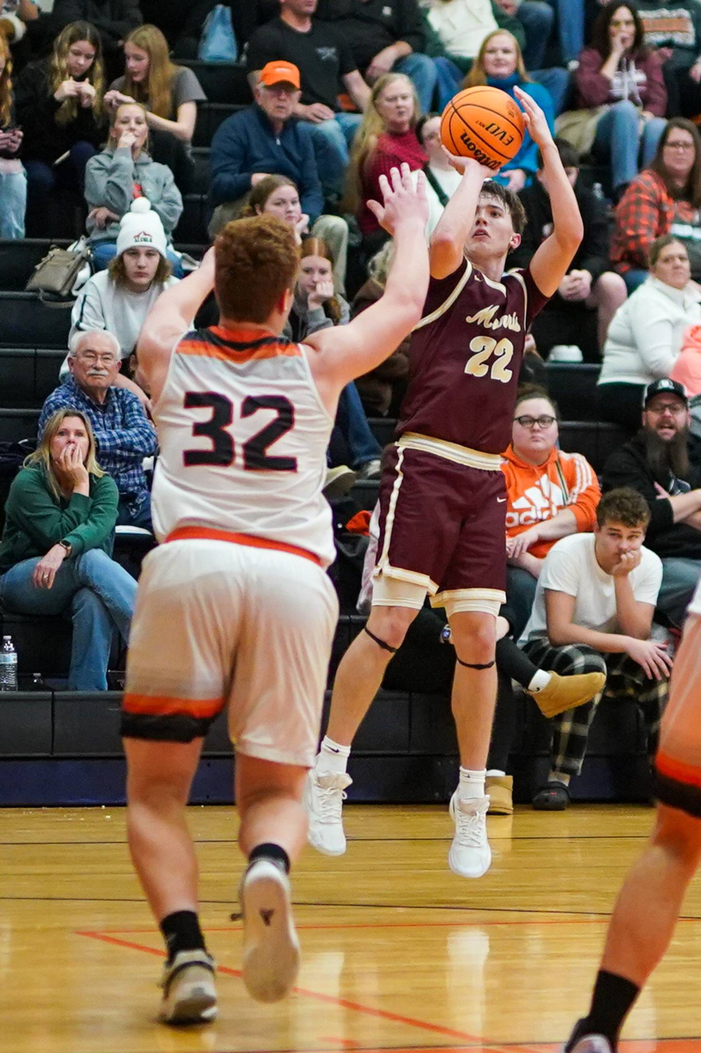 Morris’ Brett Bounds (22) shoots a three pointer against Sandwich’s Quinn Rome (32) during a basketball game at Sandwich High School on Friday, January 3, 2025.