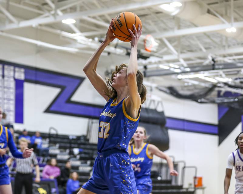 Johnsburg's Skye Toussaint (32) prepares to go back up after grabbing a rebound during their basketball game between Johnsburg at Plano, Monday Dec 16, 2024 in Plano.