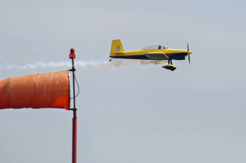 Trailing tailsmoke, a stunt plane zips by the Whiteside County Airport during the ACCA Air Show on Saturday in Rock Falls.